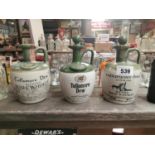 Three stoneware Tullamore dew flagons