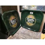 Two Carlberg drink's trays