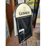 Double sided Guinness advertising menu board.