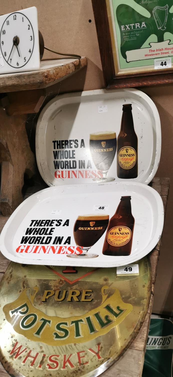 Two Guinness advertising trays.