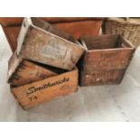 Five wooden advertising crates.