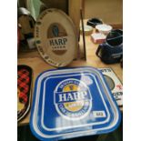 Two Harp advertising drinks trays.