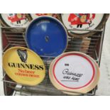 Three Guinness advertising trays