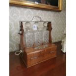 19th C. oak and polished metal tantalus .