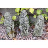 Set of three composition garden knomes.
