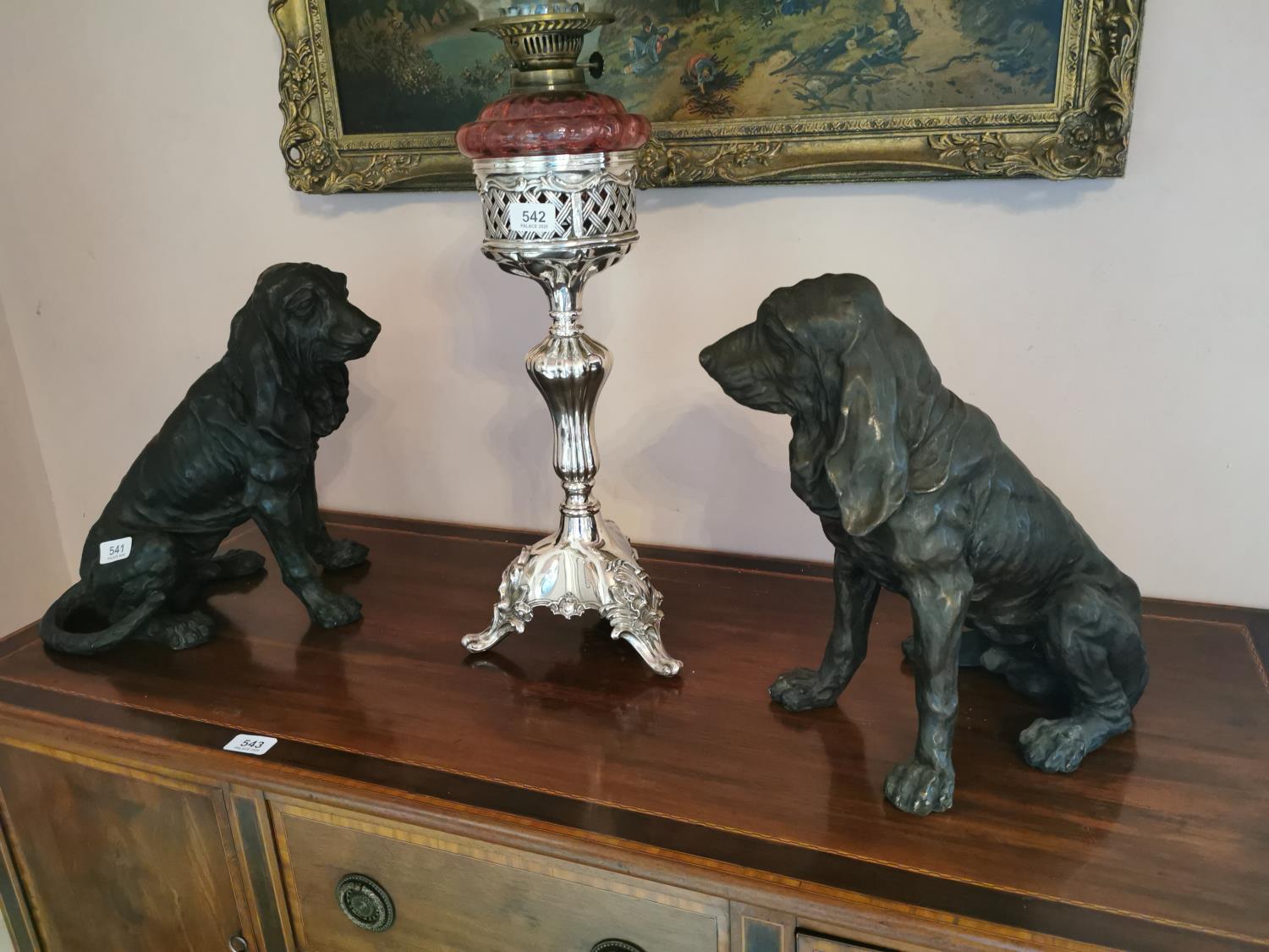 Pair of bronze models of seated dogs