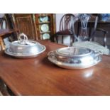 Two silver plated lidded serving dishes.