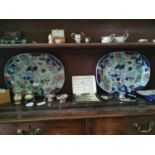 Two decorative ceramic meat platters.