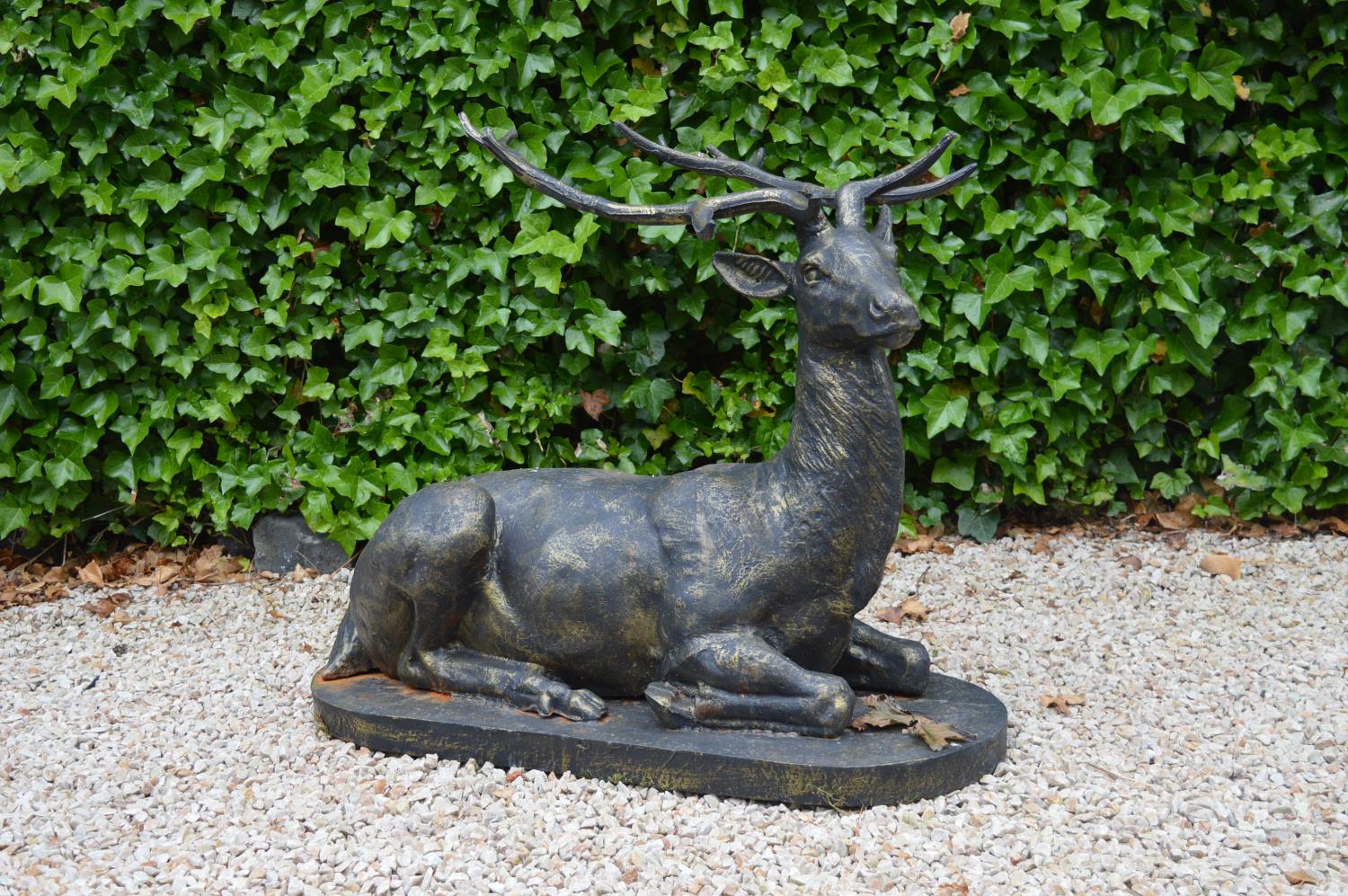 Cast iron model of a seated stag.