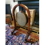 18th C. oak and brass diner gong on stand {111 cm H x 70 cm W x 65 cm D}.