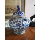 Pair of Oriental ceramic lidded vases