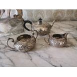 Three piece English embossed silver tea service