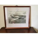 Black and white print of a Jet mounted on an oak frame.