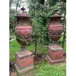 Good quality pair of terracotta lidded urns