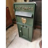 Cast iron post box with harp.