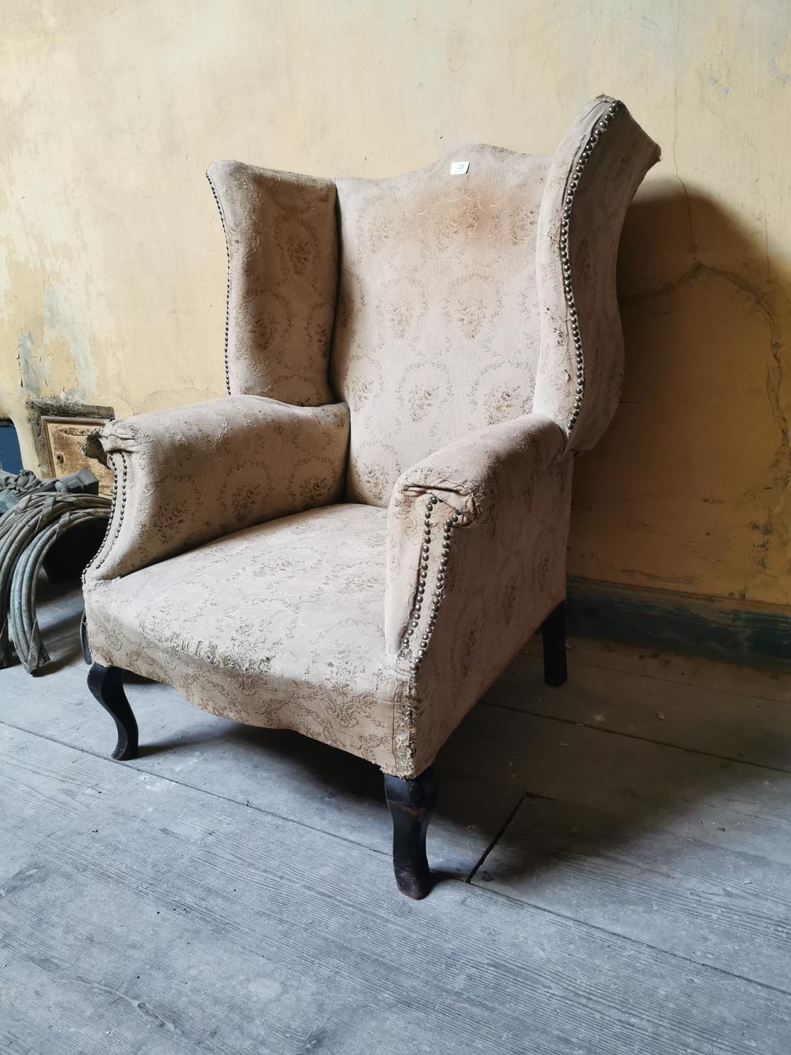 19th. C. upholstered mahogany wingback armchair.