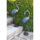 Pair of cast iron models of cranes.