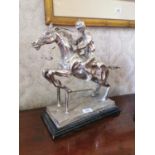 Polished metal model of Horse and Jockey.