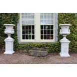 Pair of good quality cast stone garden urns.