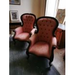 Pair of upholstered carved mahogany armchairs