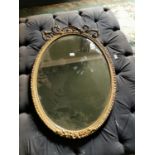 19th. C. oval gilt overmantle mirror