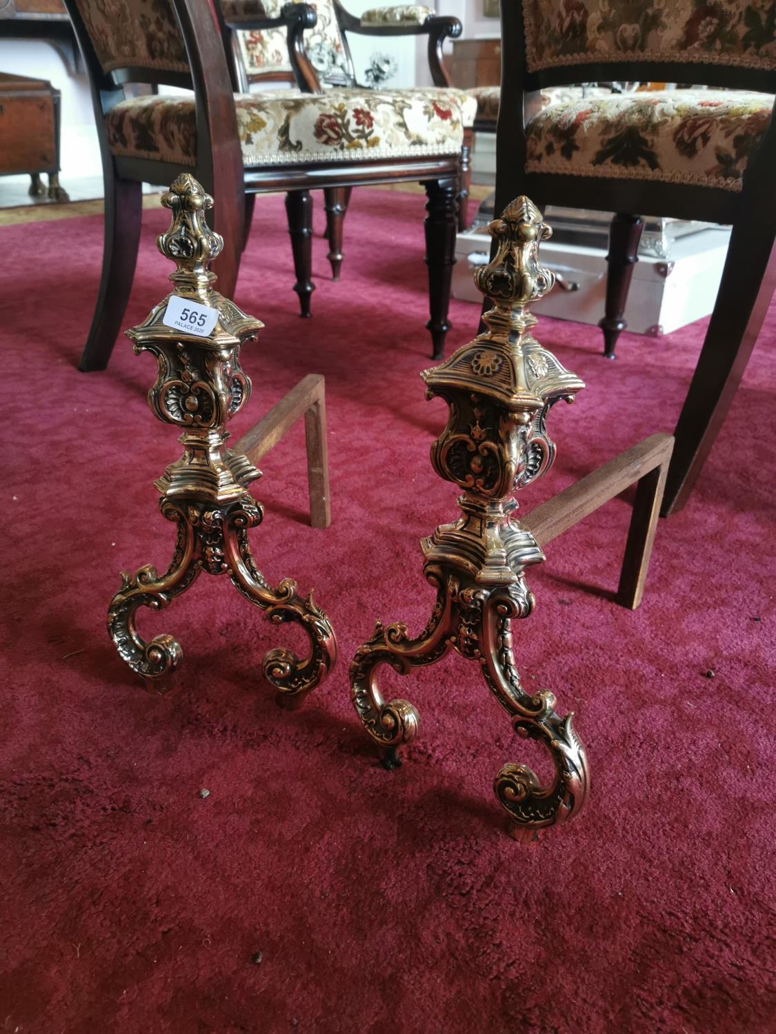 Pair of decorative brass and metal fire dogs. {