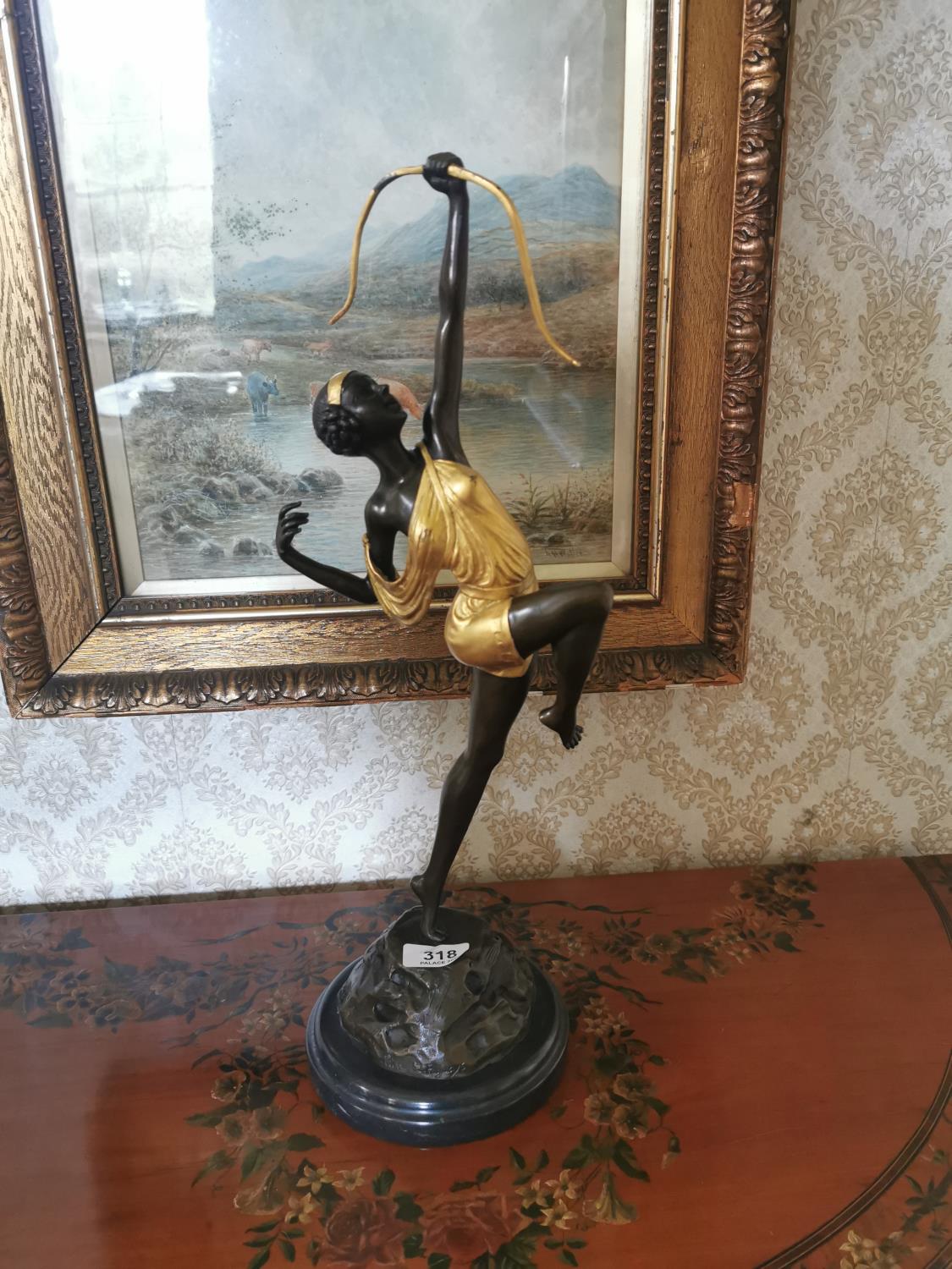 Gilded bronze of figurine of a Lady mounted on a marble base