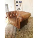 Pair of leather upholstered Chesterfield armchairs.