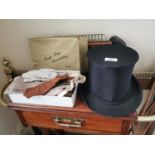 Collapsible top hat, box of ladies gloves and box with set of dentures