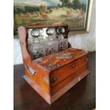 Good quality Victorian oak tantulas with three cut glass decanters and silver plate mounts {33 cm H