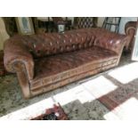 Leather upholstered Chesterfield sofa.