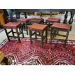 Six 1930s oak stools.