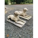 Pair of composition models of seated dogs.