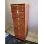 Tooled leather seven drawer filing cabinet.