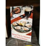 Guinness and Halford Oysters advertising sign.