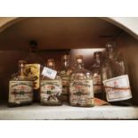 Collection of whiskey bottles with original labels and no contents.