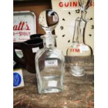 Cowan's Whiskey glass advertising decanter.
