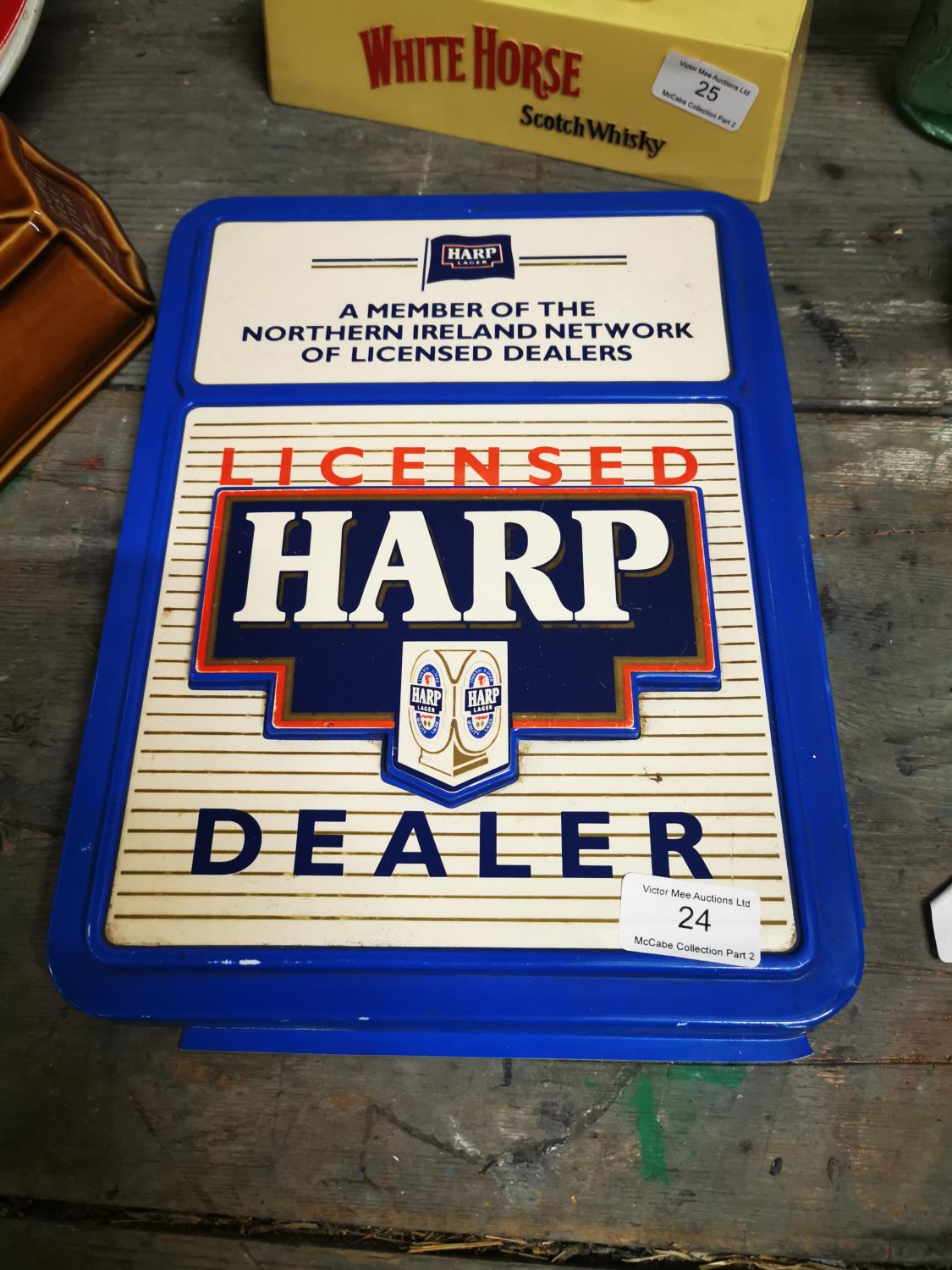 Harp Dealer plastic advertising sign.