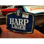 Harp Lager advertising shelf sign.