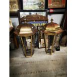 Two brass pub lanterns.