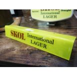 Skol International Lager advertising shelf light.