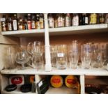 Collection of Guinness and Harp advertising glasses.