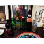 Collection of five vintage soda bottles.