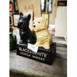 Black and White Scotch Whiskey figure.