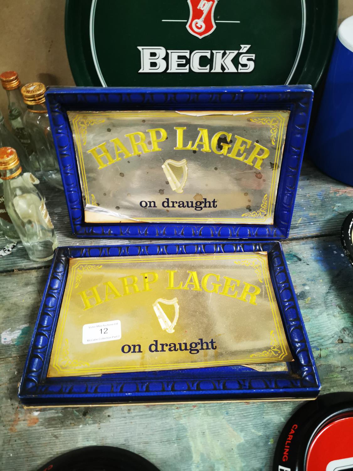Two 1970's Harp shelf advertising signs.