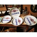 Three Furstenburg advertising drinks trays.