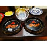 Three Bass advertising ashtrays.