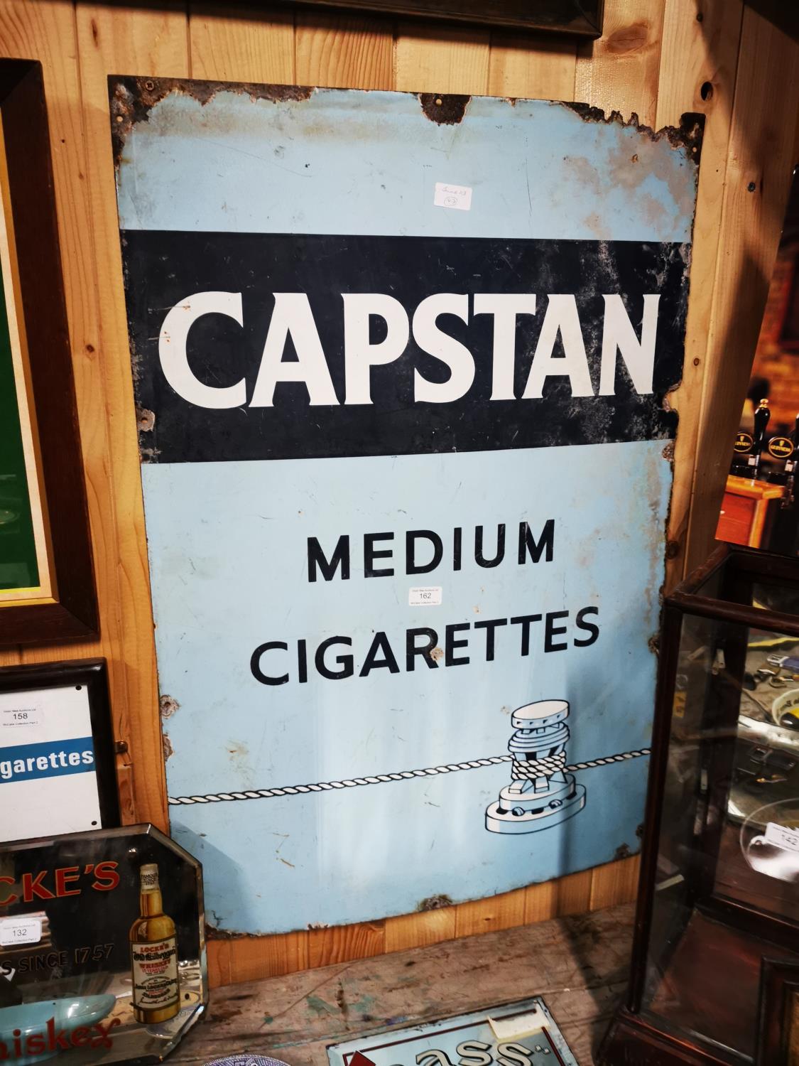 Captan's Medium Cigarettes enamel advertising sign.