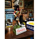 Dewar's Fine Scotch Whisky advertising figure.