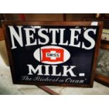Nestlé's Swiss Milk enamel advertising sign.